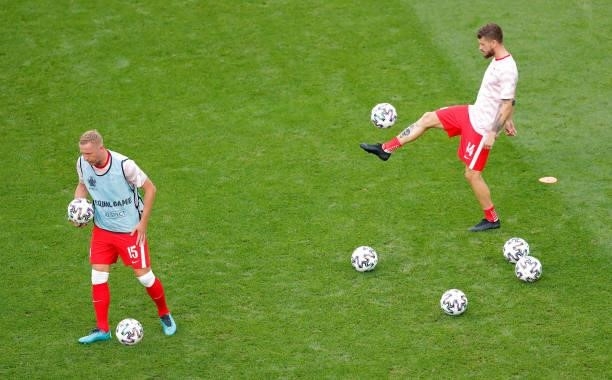 Kamil Glik and Mateusz Klich of Poland warm up prior to the UEFA Euro 2020 Championship Group E match between Sweden and Poland at Saint Petersburg...