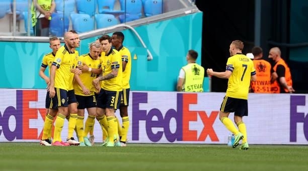 Emil Forsberg of Sweden celebrates with teammates after scoring their side's first goal during the UEFA Euro 2020 Championship Group E match between...