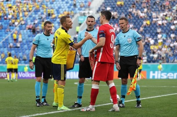 Sebastian Larsson of Sweden interacts with Robert Lewandowski of Poland prior to the UEFA Euro 2020 Championship Group E match between Sweden and...