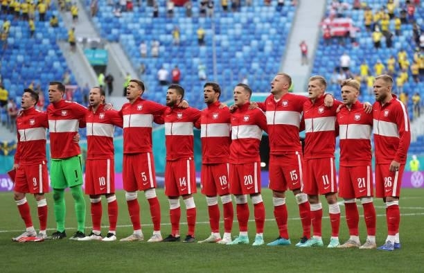 Players of Poland stand for the national anthem prior to the UEFA Euro 2020 Championship Group E match between Sweden and Poland at Saint Petersburg...
