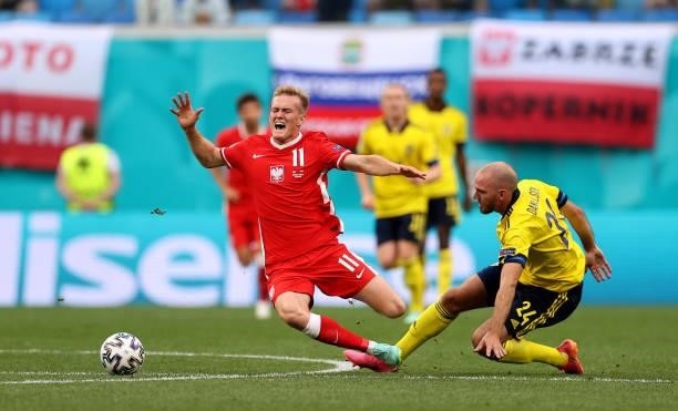 Karol Swiderski of Poland is challenged by Marcus Danielson of Sweden during the UEFA Euro 2020 Championship Group E match between Sweden and Poland...