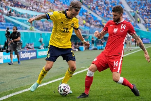 Kristoffer Olsson of Sweden is challenged by Mateusz Klich of Poland during the UEFA Euro 2020 Championship Group E match between Sweden and Poland...