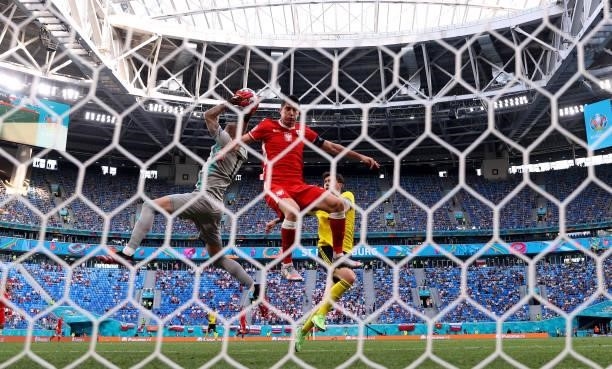 Robin Olsen of Sweden catches the ball whilst under pressure from Robert Lewandowski of Poland during the UEFA Euro 2020 Championship Group E match...