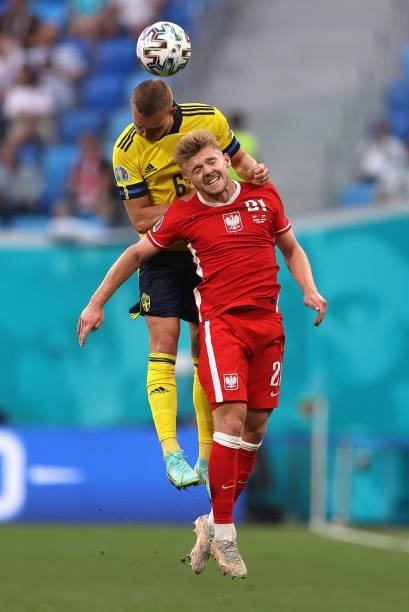 Ludwig Augustinsson of Sweden battles for a header with Kamil Jozwiak of Poland during the UEFA Euro 2020 Championship Group E match between Sweden...