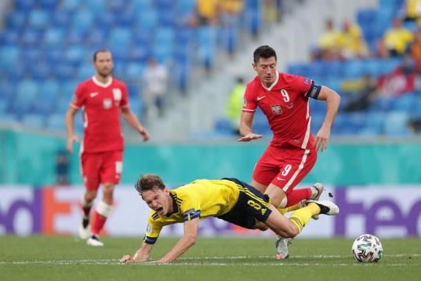 Albin Ekdal of Sweden goes down after a challenge from Robert Lewandowski of Poland during the UEFA Euro 2020 Championship Group E match between...