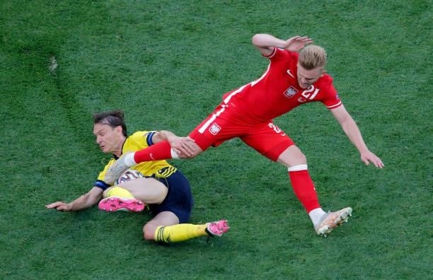 Kamil Jozwiak of Poland is challenged by Albin Ekdal of Sweden during the UEFA Euro 2020 Championship Group E match between Sweden and Poland at...