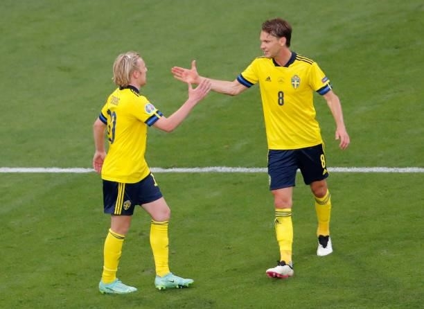 Emil Forsberg celebrates with teammate Albin Ekdal after scoring their side's second goal during the UEFA Euro 2020 Championship Group E match...