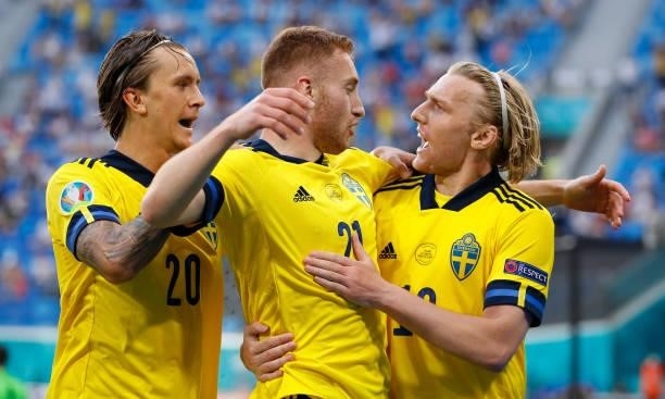 Emil Forsberg celebrates with teammates Dejan Kulusevski and Kristoffer Olsson after scoring their side's second goal during the UEFA Euro 2020...