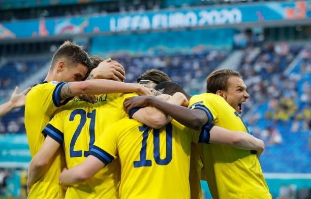 Emil Forsberg celebrates with teammates after scoring their side's second goal during the UEFA Euro 2020 Championship Group E match between Sweden...