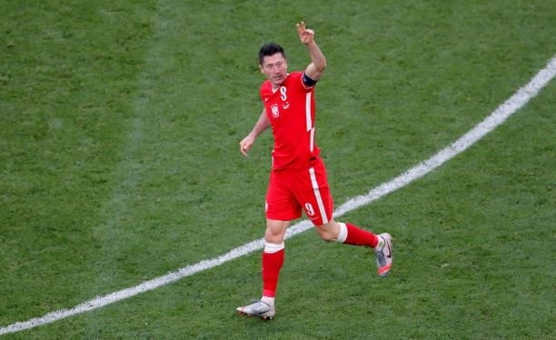 Robert Lewandowski of Poland celebrates after scoring their side's first goal during the UEFA Euro 2020 Championship Group E match between Sweden and...