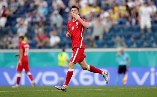 Robert Lewandowski of Poland celebrates after scoring their side's first goal during the UEFA Euro 2020 Championship Group E match between Sweden and...
