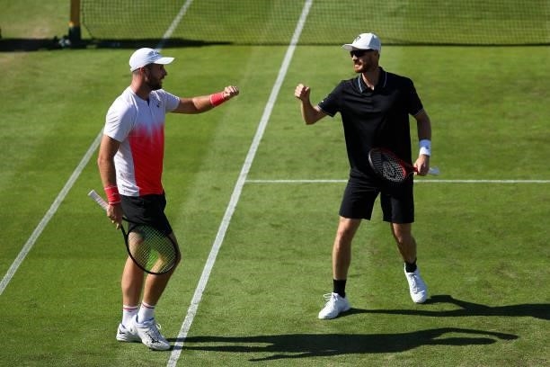 Jamie Murray and Luke Bambridge of Great Britain in action during their first round mens doubles match against Fabrice Martin and Edouard...