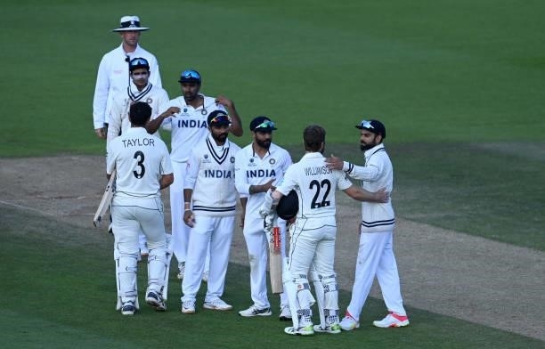 India captain Virat Kohli congratulates Kane Williamson of New Zealand on winning the ICC World Test Championship Final between India and New Zealand...