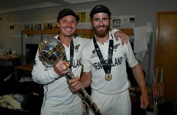 Watling and Kane Williamson of New Zealand celebrate winning in the dressing rooms after winning the ICC World Test Championship Final between India...