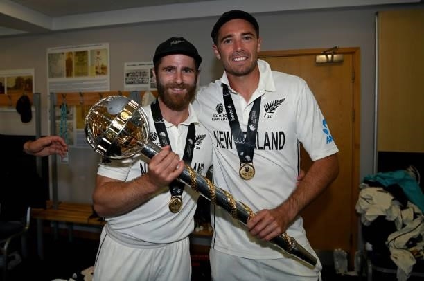 Kane Williamson and Tim Southee of New Zealand celebrate winning in the dressing rooms after winning the ICC World Test Championship Final between...