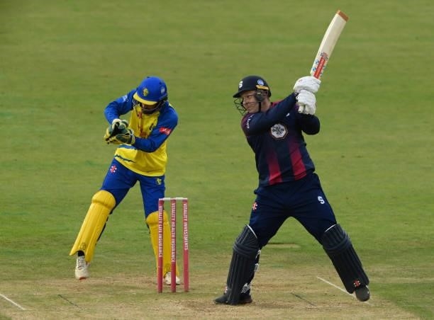 Northants batsman Adam Rossington hits out watched by Ned Eckersley during the Vitality T20 Blast Match between Durham Cricket and Northamptonshire...