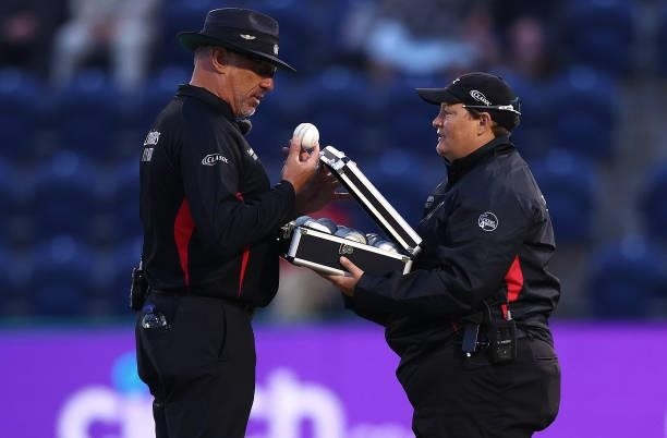 Sue Redfern the fourth official brings a case of new balls after the current one was hit out of the ground during the T20 International Series first...