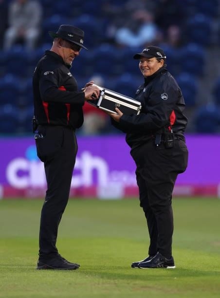 Sue Redfern the fourth official brings a case of new balls after the current one was hit out of the ground during the T20 International Series first...