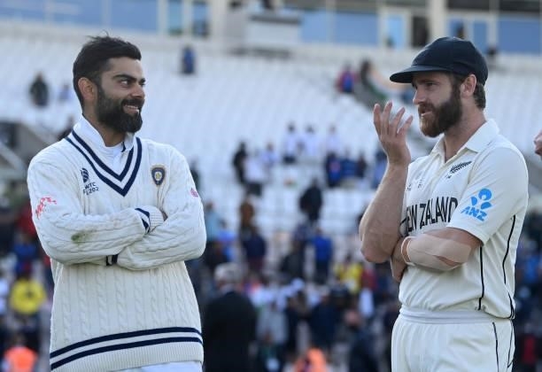 India captain Virat Kohli and New Zealand captain Kane Williamson speak during Day 6 of the ICC World Test Championship Final between India and New...