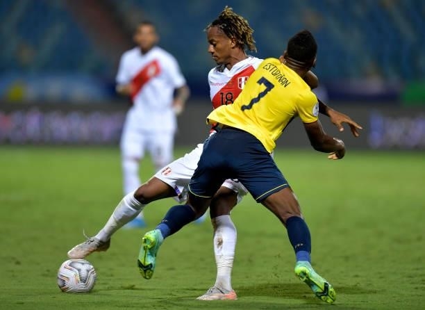 André Carrillo of Peru fights for the ball with Pervis Estupiñan of Ecuador during a Group B match between Ecuador and Peru as part of Copa America...