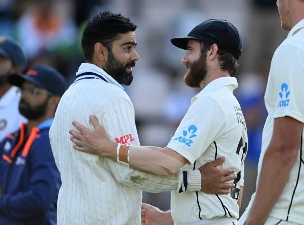 Virat Kohli of India and Kane Williamson of New Zealand talk after the ICC World Test Championship Final against India at The Hampshire Bowl on June...