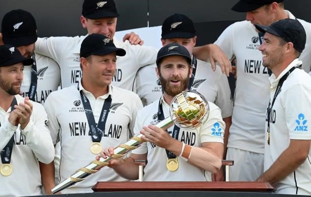 Kane Williamson of New Zealand holds the Test mace with Devon Conway , Neil Wagner and Tim Southee after the ICC World Test Championship Final...
