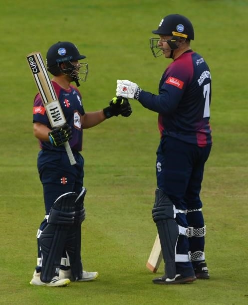 Northants batsman Ricardo Vasconcelos is congratulated by Adam Rossington after reaching 50 during their 100 partnership during the Vitality T20...