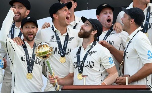 Kane Williamson smiles as he holds the Test mace after New Zealand won the ICC World Test Championship Final against India at The Hampshire Bowl on...