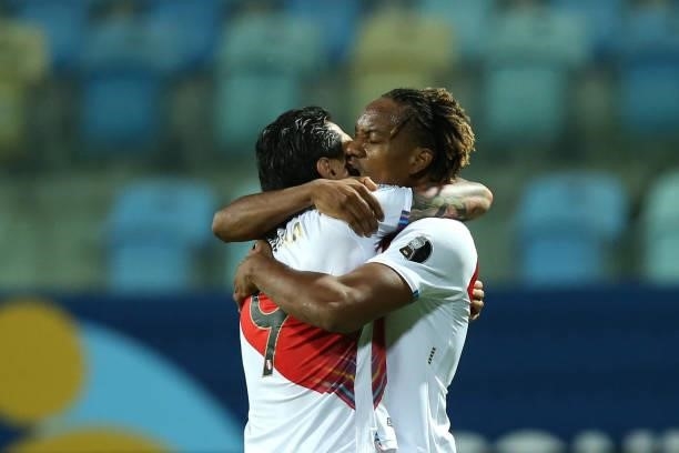 André Carrillo of Peru celebrates with teammate Gianluca Lapadula after scoring the second goal of his team during a Group B match between Ecuador...