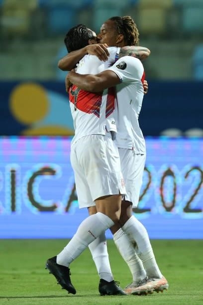 André Carrillo of Peru celebrates with teammate Gianluca Lapadula after scoring the second goal of his team during a Group B match between Ecuador...