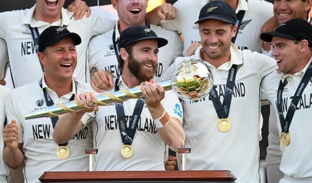 Kane Williamson of New Zealand holds the Test mace with Neil Wagner, Tim Southee and Tom Latham after the ICC World Test Championship Final between...