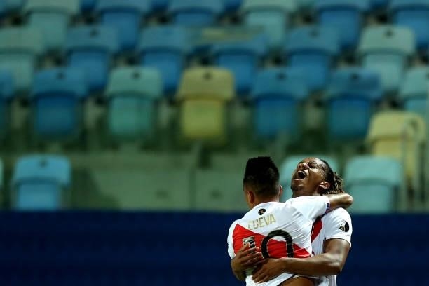 André Carrillo of Peru celebrates with teammate Christian Cueva after scoring the second goal of his team during a Group B match between Ecuador and...
