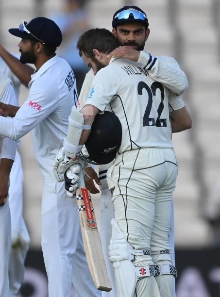 Virat Kohli embraces Kane Williamson of New Zealand after New Zealand won the ICC World Test Championship Final between India and New Zealand at The...