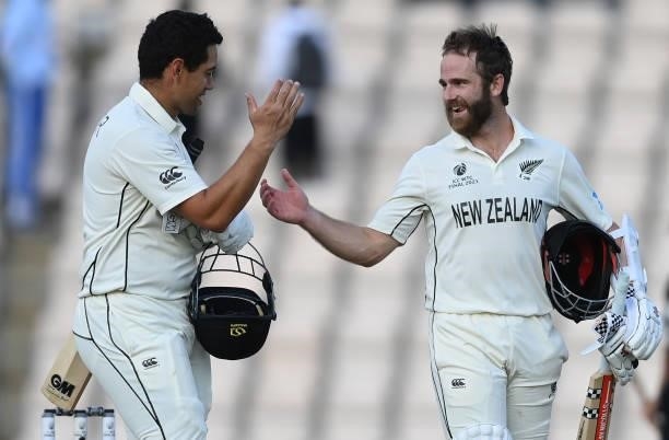 Ross Taylor and Kane Williamson smile as they leave the field after New Zealand won the ICC World Test Championship Final against India at The...