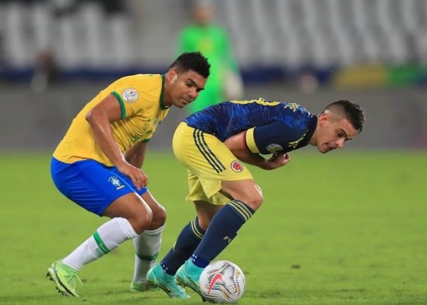 Rafael Santos Borre of Colombia fights for the ball with Casemiro of Brazil during a Group B match between Brazil and Colombia as part of Copa...