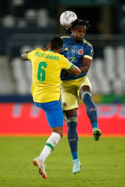 Duvan Zapata of Colombia heads the ball against Alex Sandro of Brazil during a Group B match between Brazil and Colombia as part of Copa America...