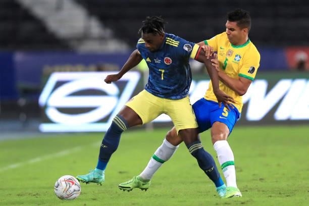 Duvan Zapata of Colombia fights for the ball with Casemiro of Brazil during a Group B match between Brazil and Colombia as part of Copa America...