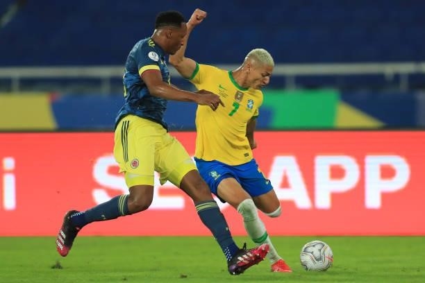 Richarlison of Brazil fights for the ball with Yerry Mina of Colombia during a Group B match between Brazil and Colombia as part of Copa America...