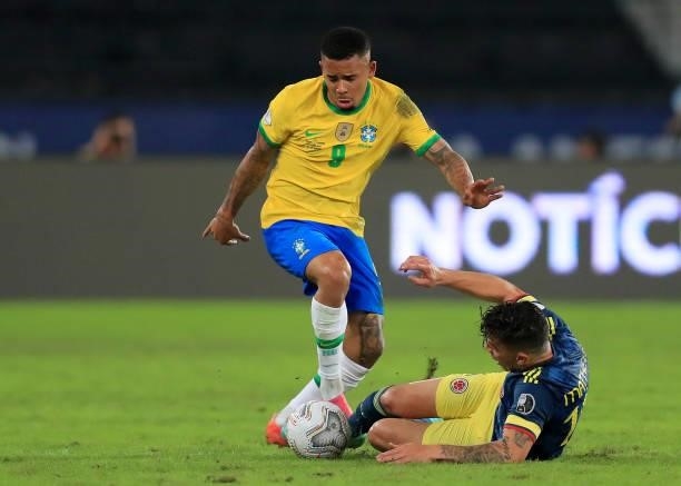 Gabriel Jesus of Brazil fights for the ball with Mateus Uribe of Colombia during a Group B match between Brazil and Colombia as part of Copa America...