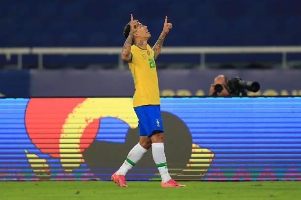Roberto Firmino of Brazil celebrates after scoring the first goal of his team during a Group B match between Brazil and Colombia as part of Copa...