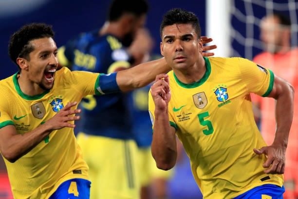Casemiro of Brazil celebrates with teammate Marquinhos after scoring the second goal of his team during a Group B match between Brazil and Colombia...