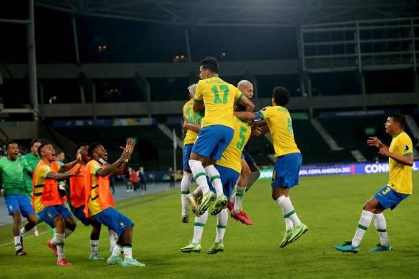 Casemiro of Brazil celebrates with teammates after scoring the the second goal of his team during a Group B match between Brazil and Colombia as part...