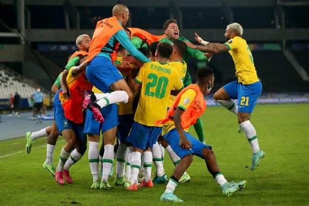 Players of Brazil celebrate with teammate Casemiro after scoring the the second goal of his team during a Group B match between Brazil and Colombia...