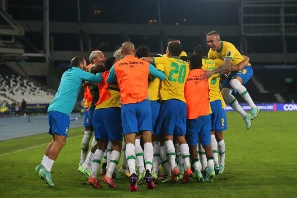 Players of Brazil celebrate with teammate Casemiro after scoring the the second goal of his team during a Group B match between Brazil and Colombia...