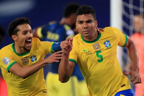 Neymar Jr. Of Brazil celebrates with teammate Marquinhos after scoring the the second goal of his team during the Group B match between Brazil and...