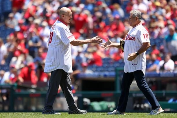 Former Philadelphia Phillies"u2019 pitcher Rick Wise, shakes hands with Larry Bowa after throwing out the first pitch on the 50th anniversary of his...