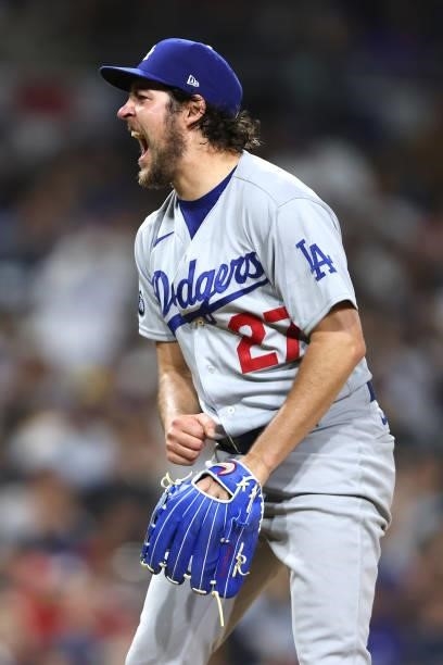 Trevor Bauer of the Los Angeles Dodgers reacts to striking out Trent Grisham of the San Diego Padres to end the sixth inning of a game at PETCO Park...