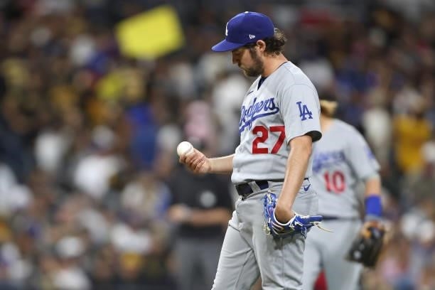 Trevor Bauer of the Los Angeles Dodgers looks on after allowing a solo homerun to Victor Caratini of the San Diego Padres during the seventh inning...