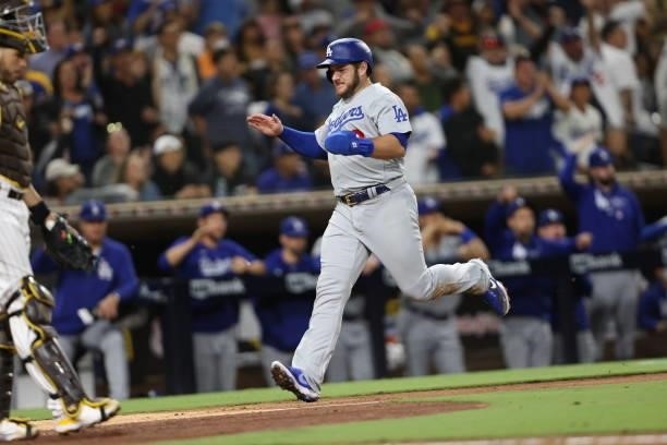 Max Muncy scores on an RBI single hit by Justin Turner of the Los Angeles Dodgers during the eighth inning of a game against the San Diego Padres at...