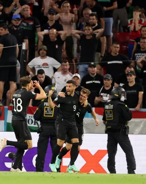 Leon Goretzka of germany celebrates as he scores the goal 2:2 in direction to the hungarian Fans with Kevin Volland of germany and Joshua Kimmich of...